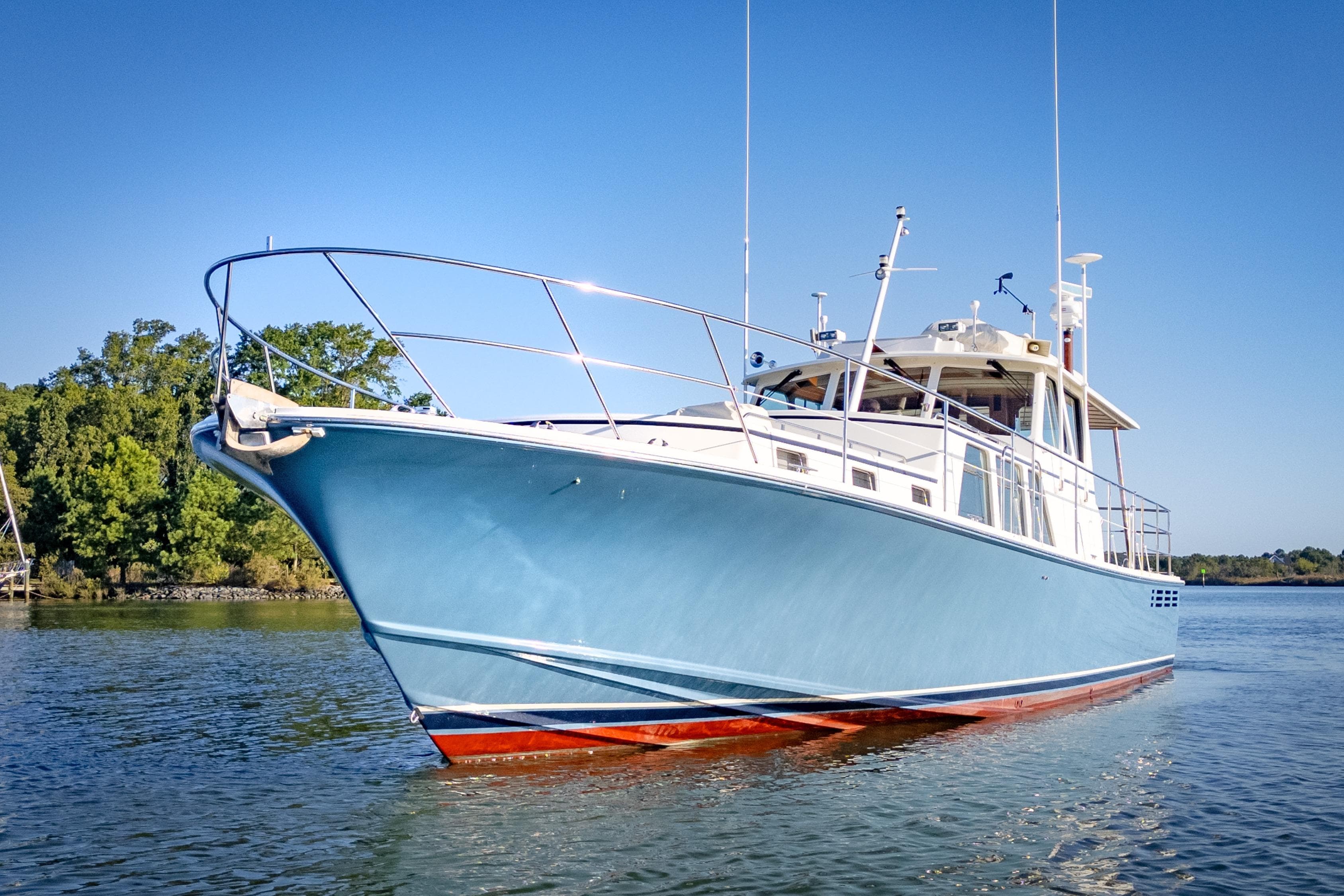 2001 Dettling 51 yacht on calm water, clear sky background.