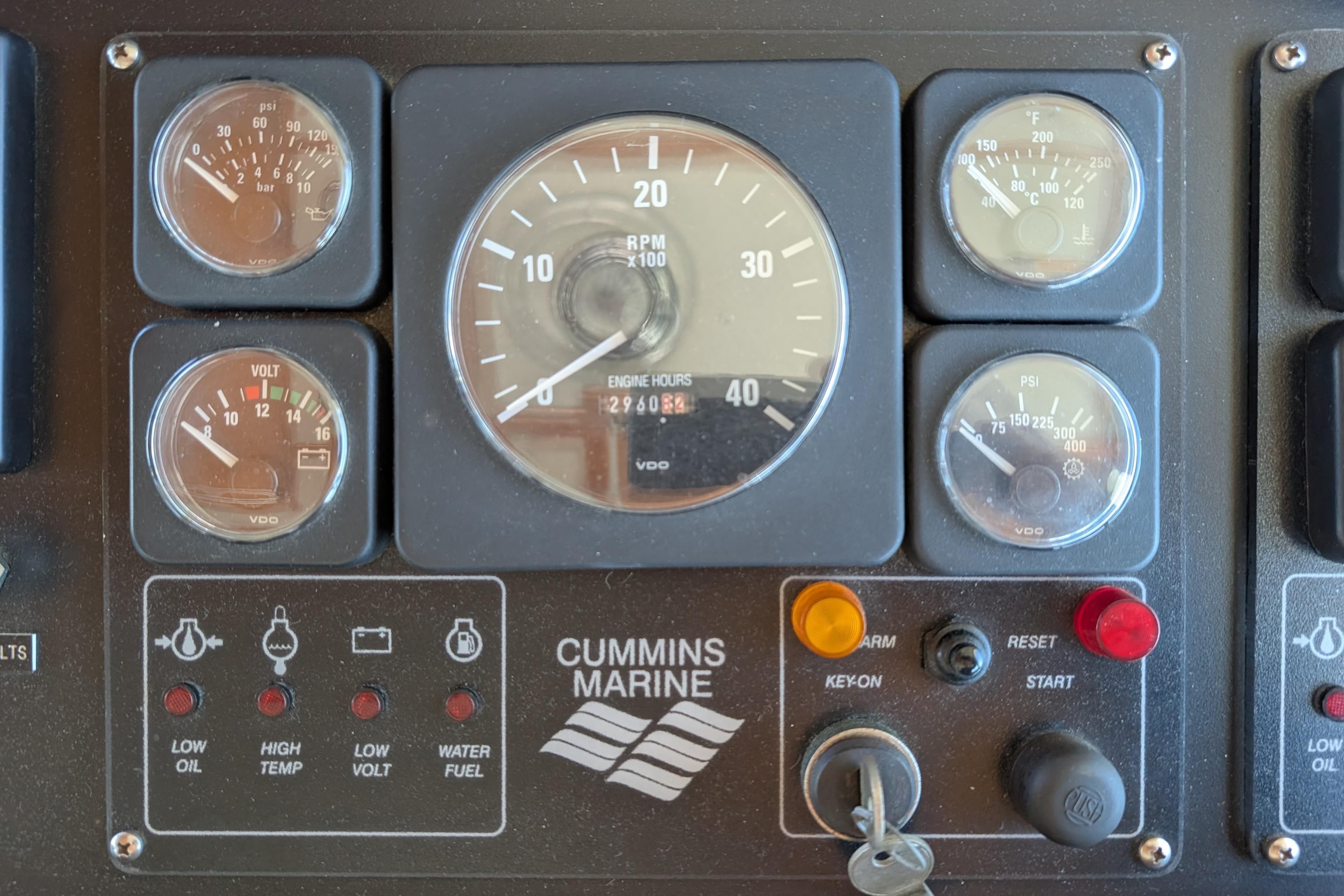 Control panel of a 2001 Dettling 51 boat with Cummins Marine gauges and indicators.