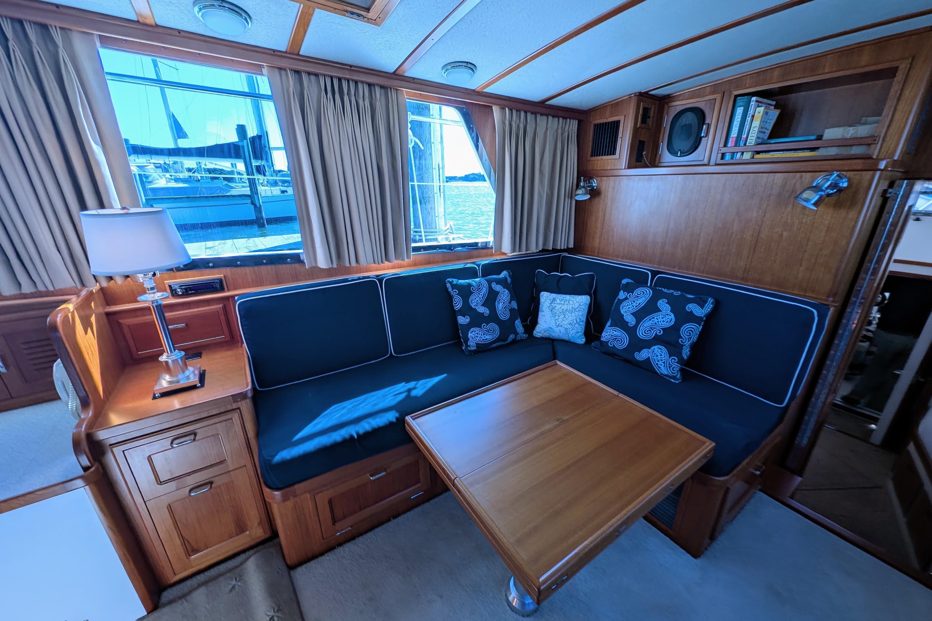 Luxurious 2001 Dettling 51 yacht interior with elegant wood finish and comfortable seating.