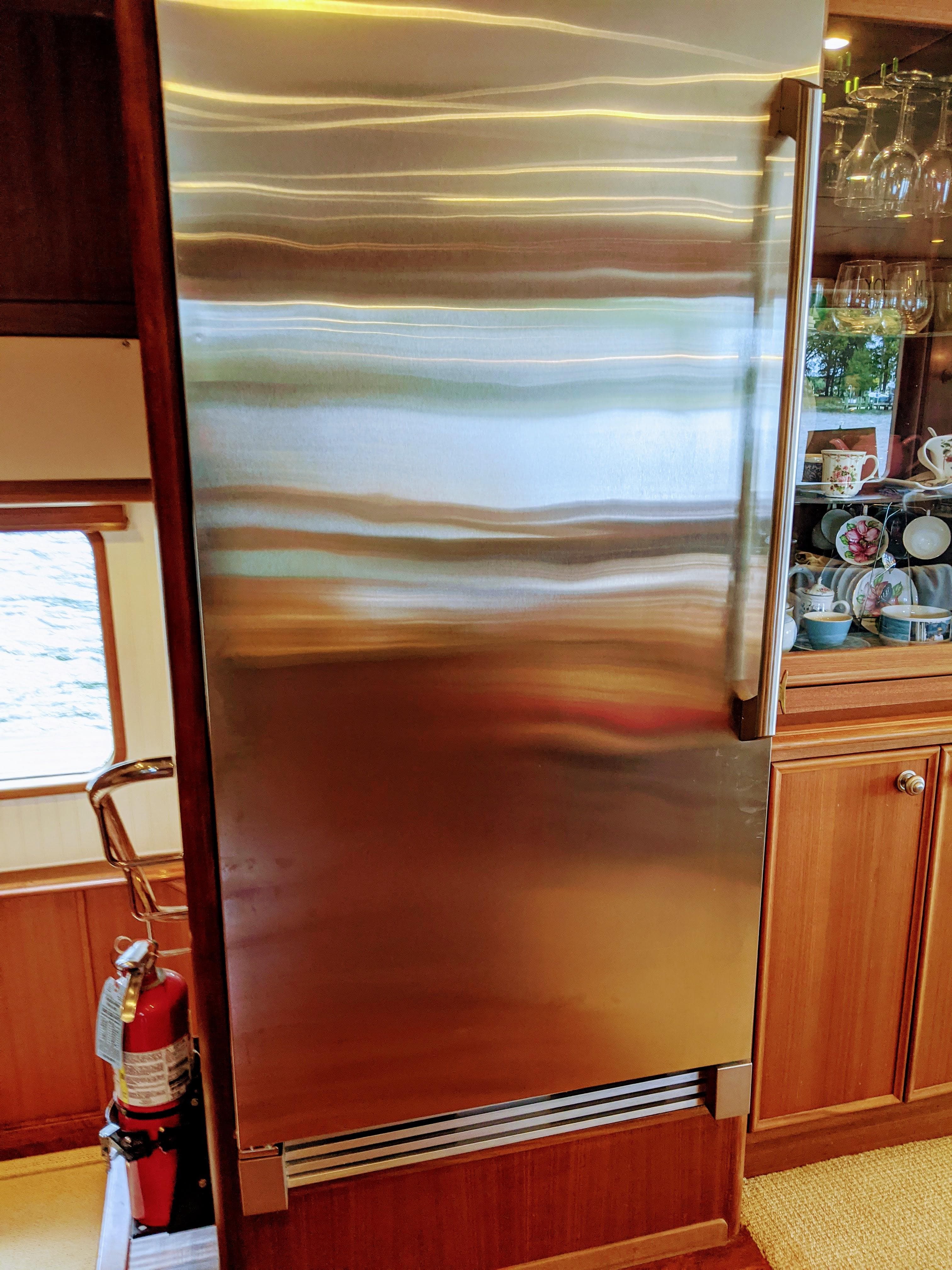 Stainless steel refrigerator in 2017 Northern Marine Expedition yacht kitchen.