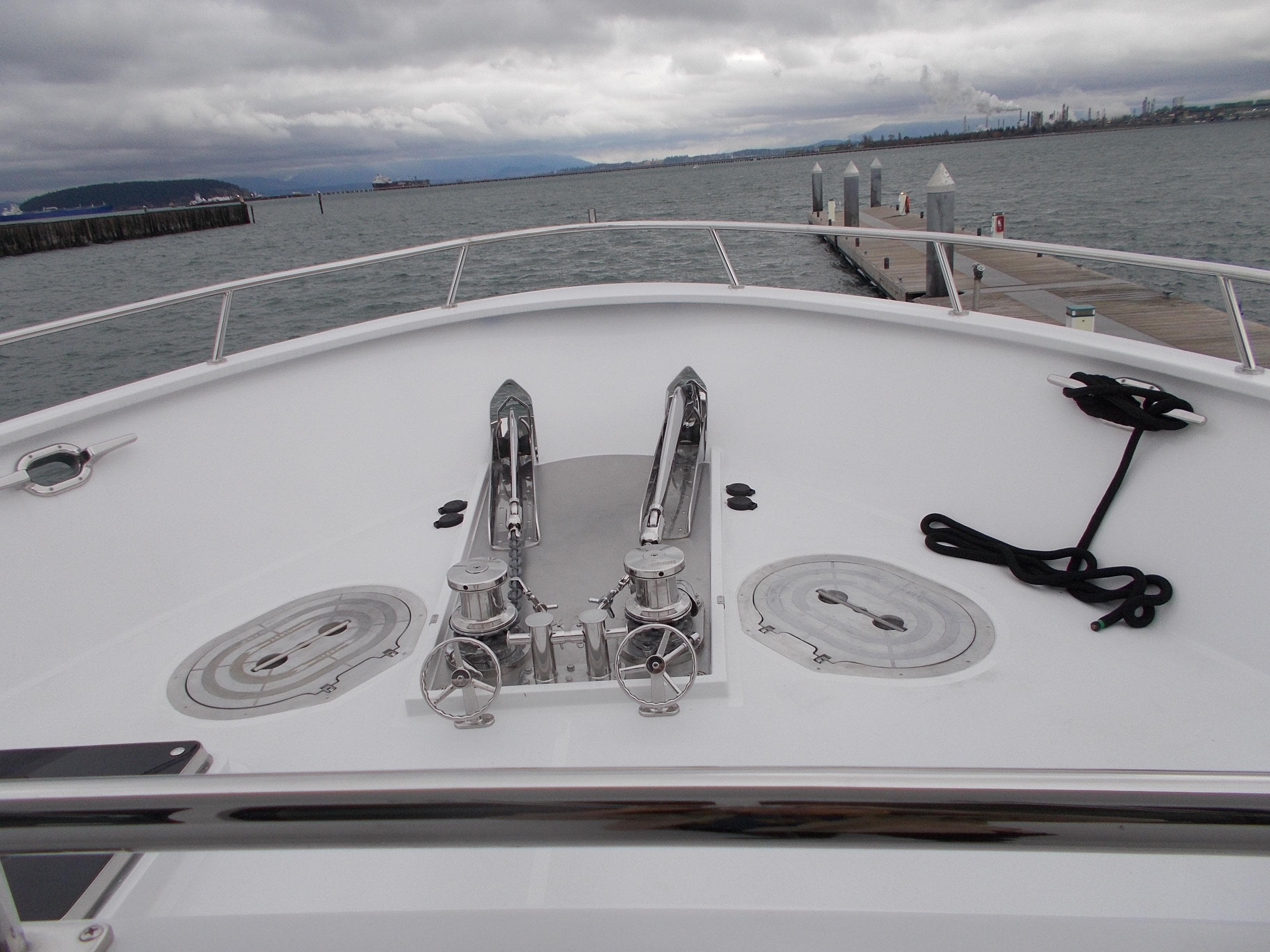 Bow view of 2017 Northern Marine Expedition yacht at dock, overcast sky.