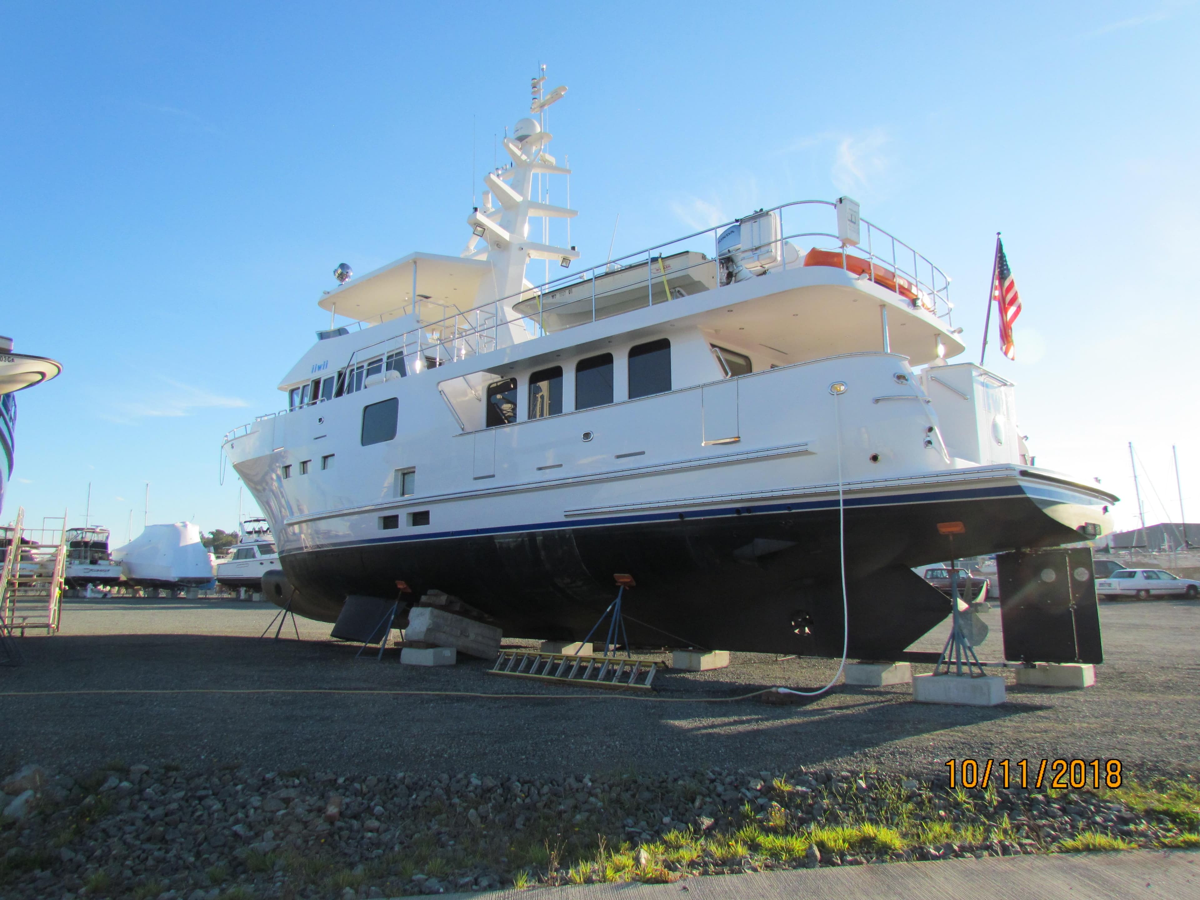 2017 Northern Marine Expedition yacht on dry dock with American flag.