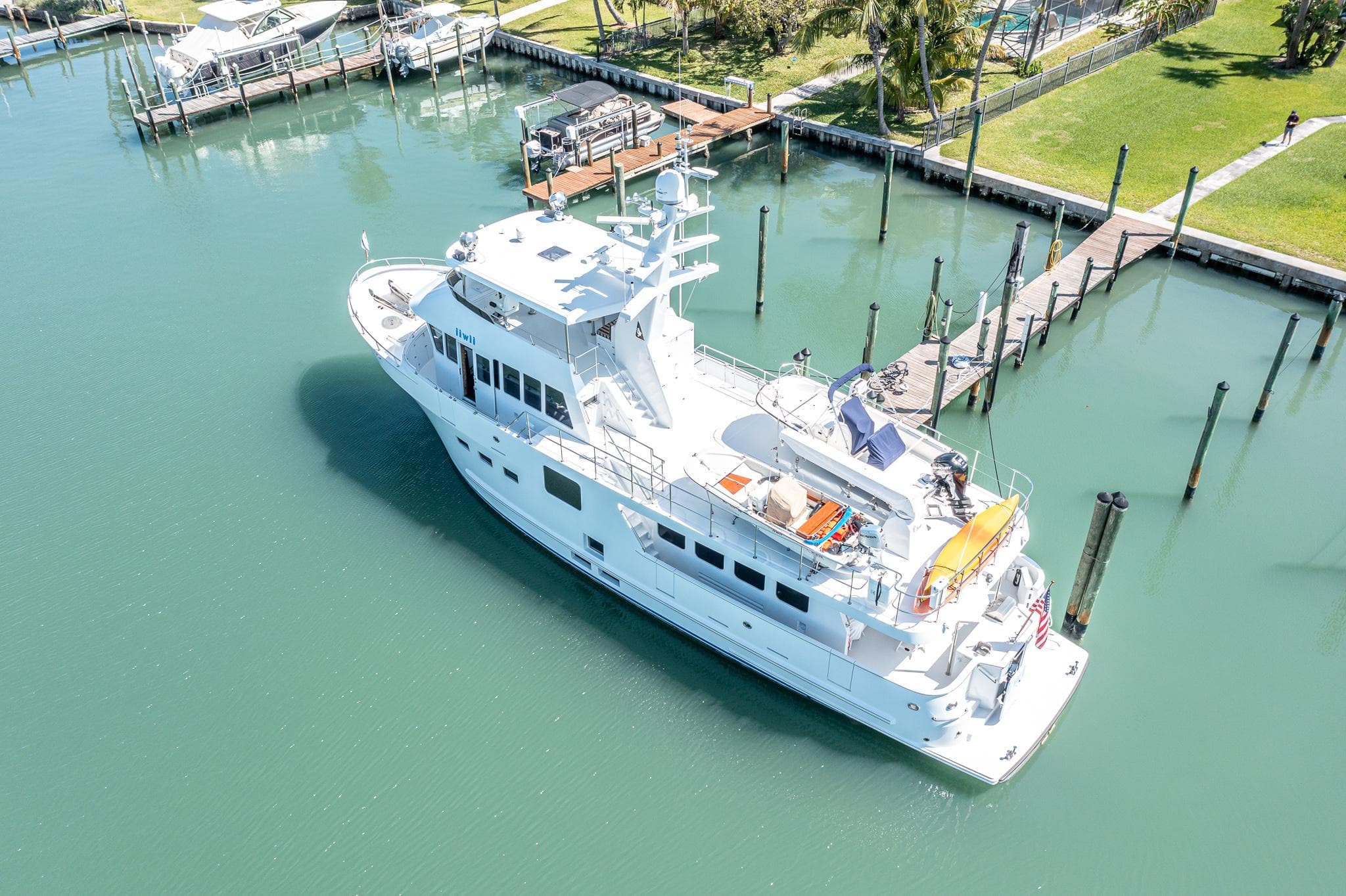 2017 Northern Marine Expedition yacht docked in a serene marina setting.