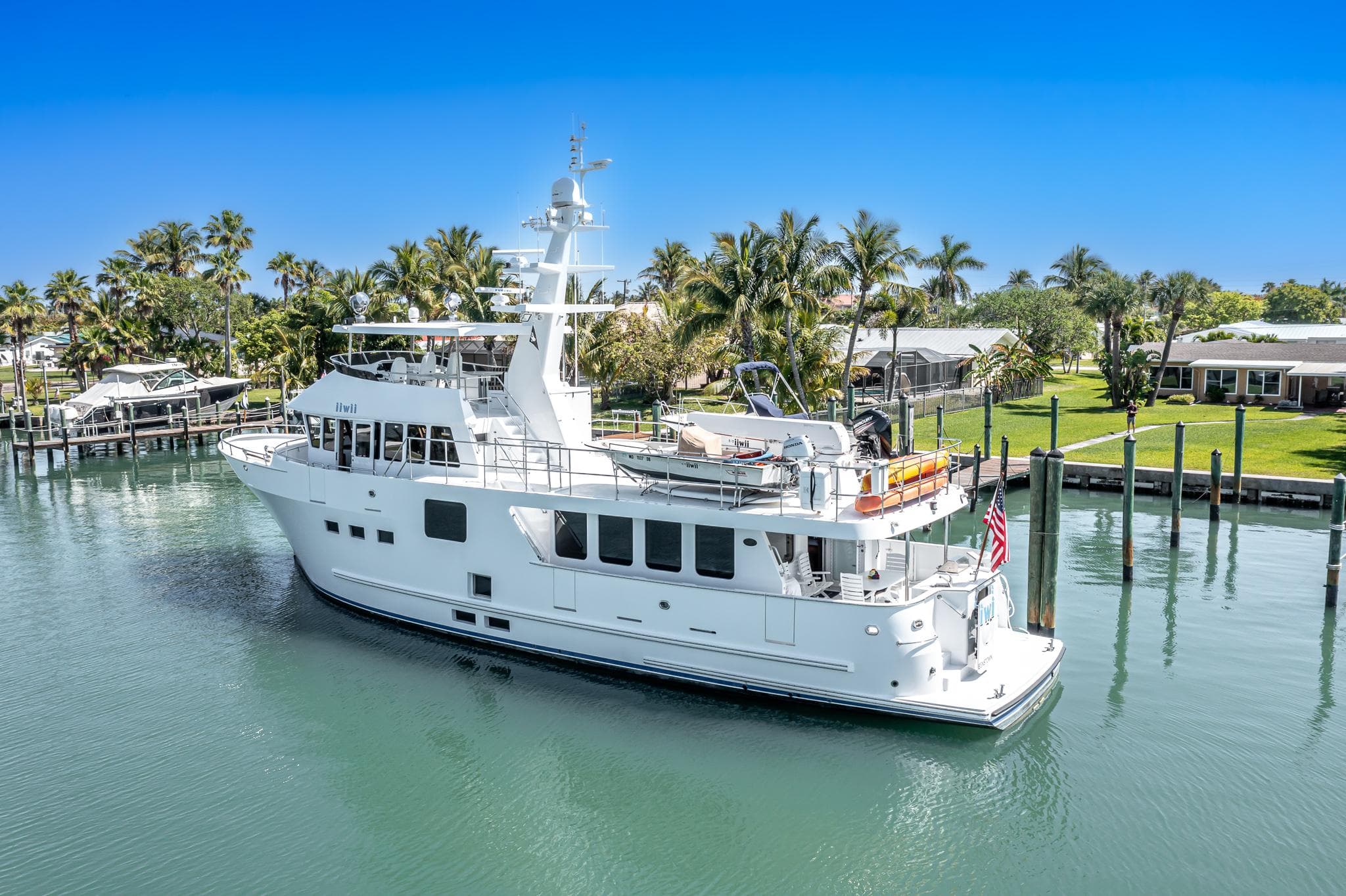 2017 Northern Marine Expedition yacht docked in a tropical marina setting.