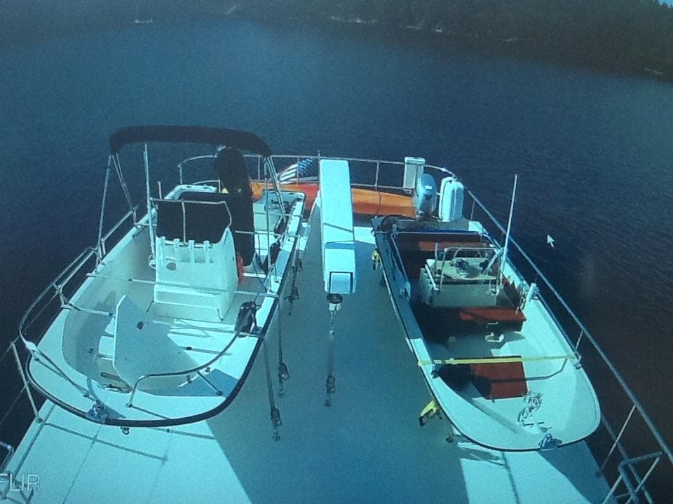 2017 Northern Marine Expedition yacht deck with boats and equipment on calm water.