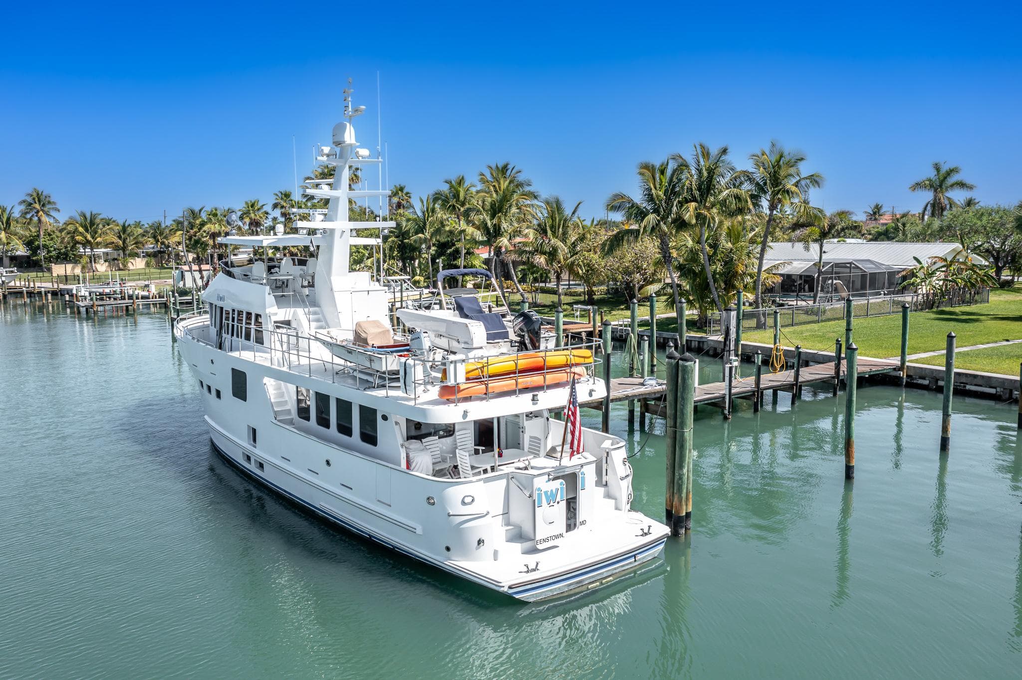 2017 Northern Marine Expedition yacht docked in a tropical marina setting.