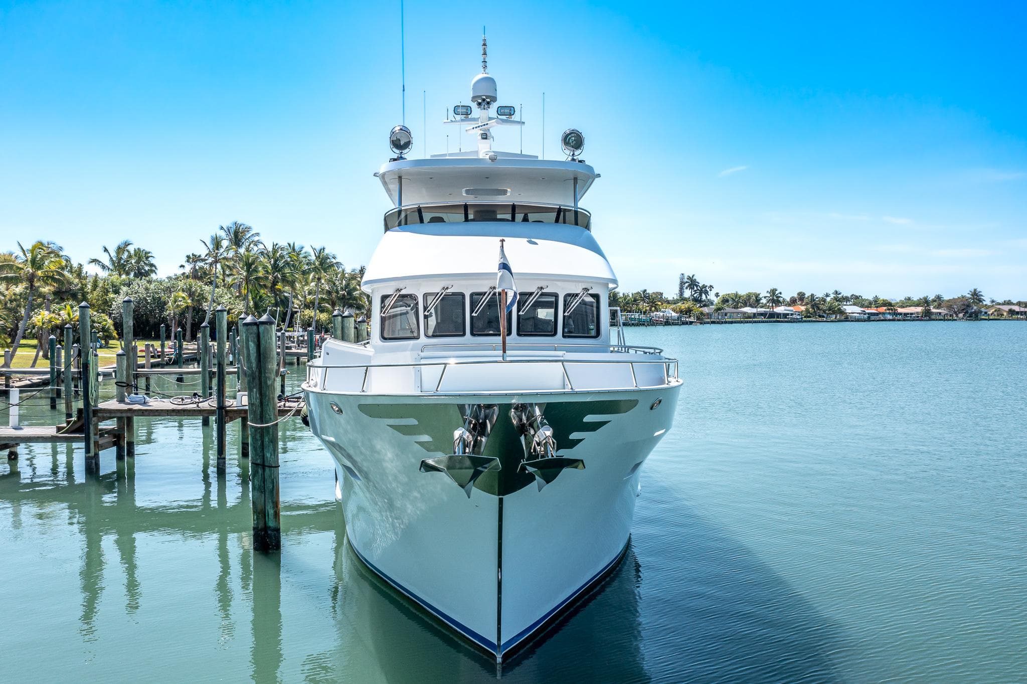 2017 Northern Marine Expedition yacht docked in a serene marina setting.