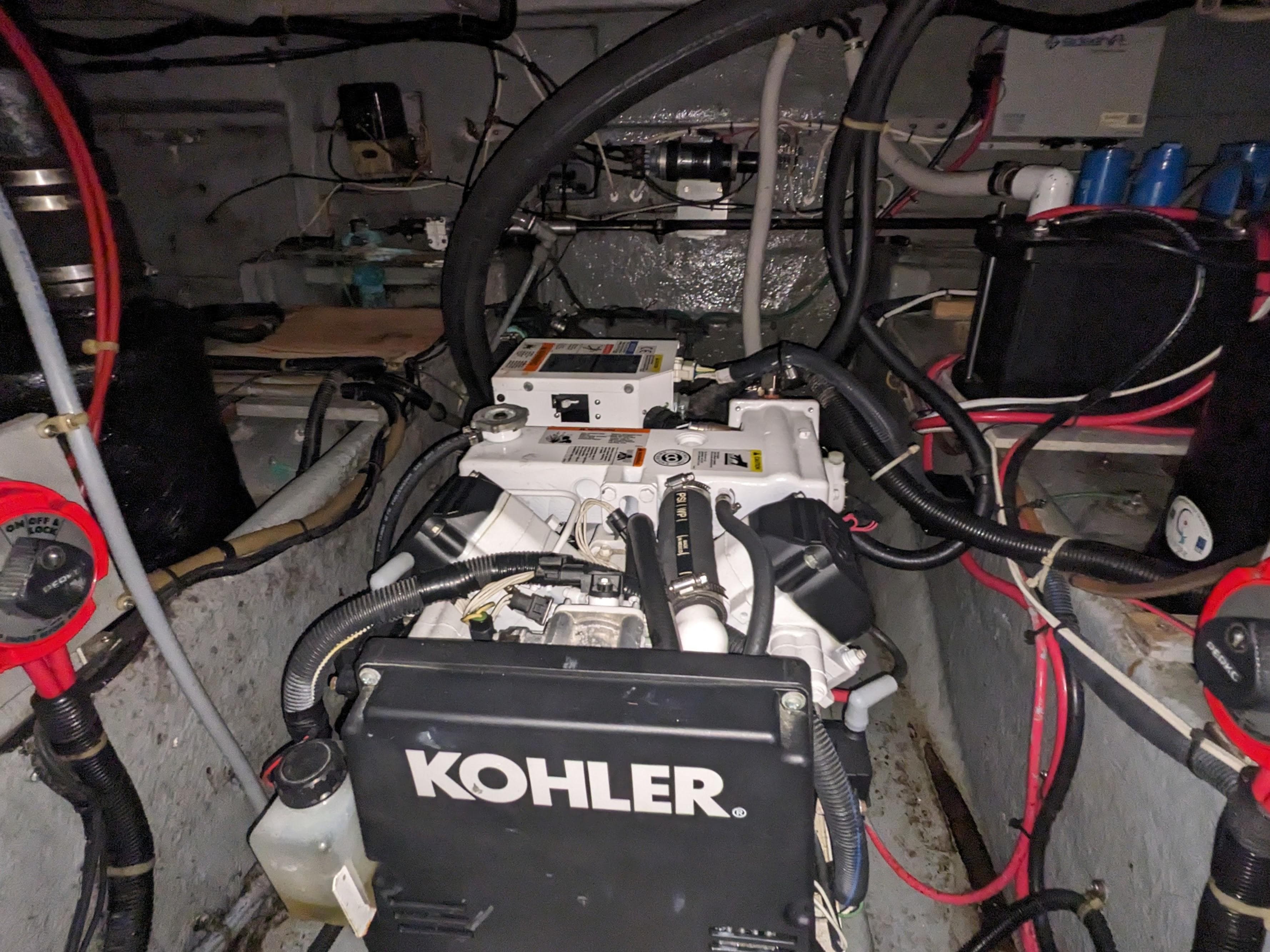 Engine room of 1988 Sea Ray 390 Express Cruiser with Kohler generator.