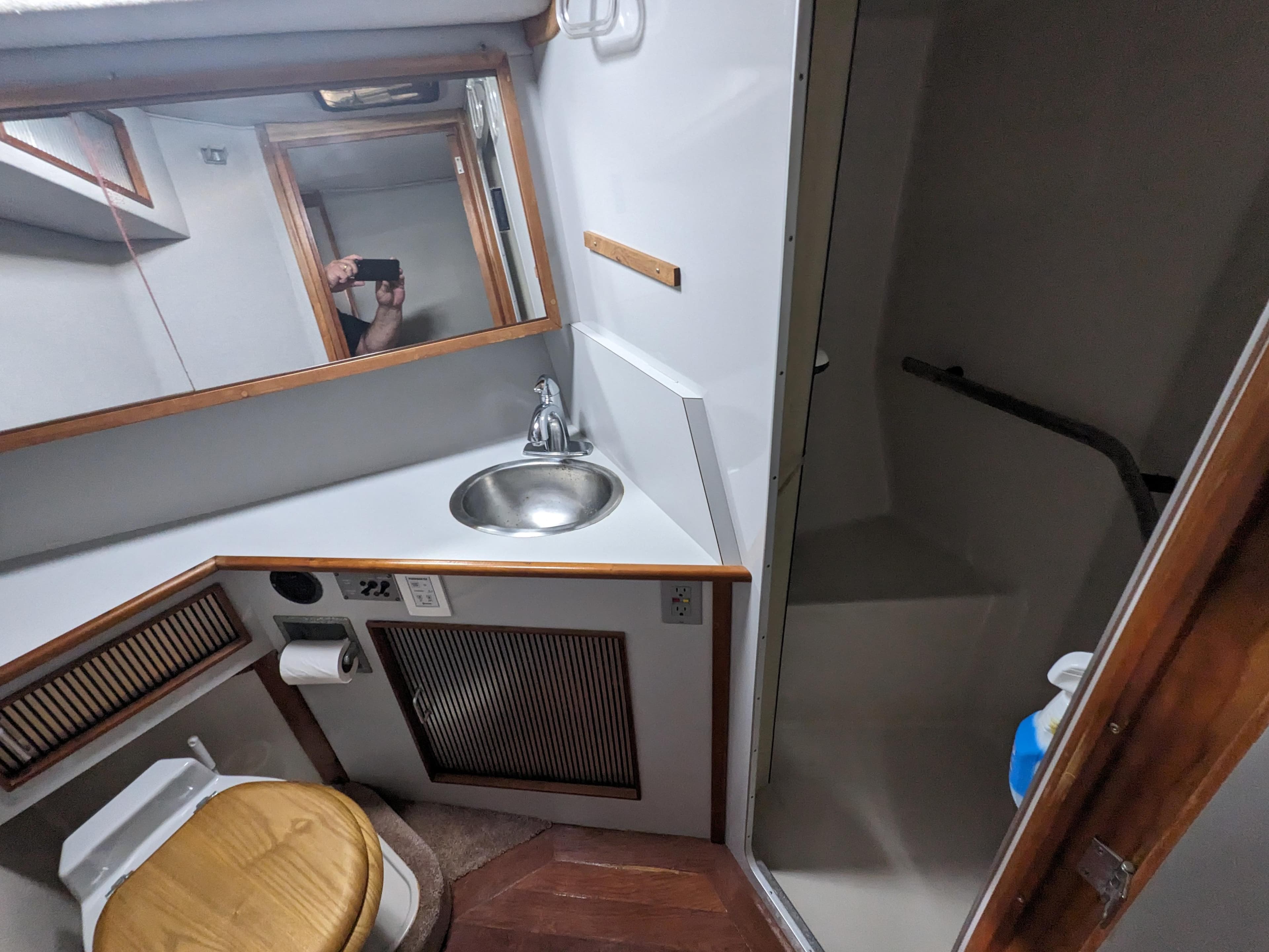 1988 Sea Ray 390 Express Cruiser bathroom with sink, toilet, and shower.